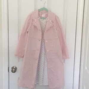 White eyelet dress with pink overcoat.